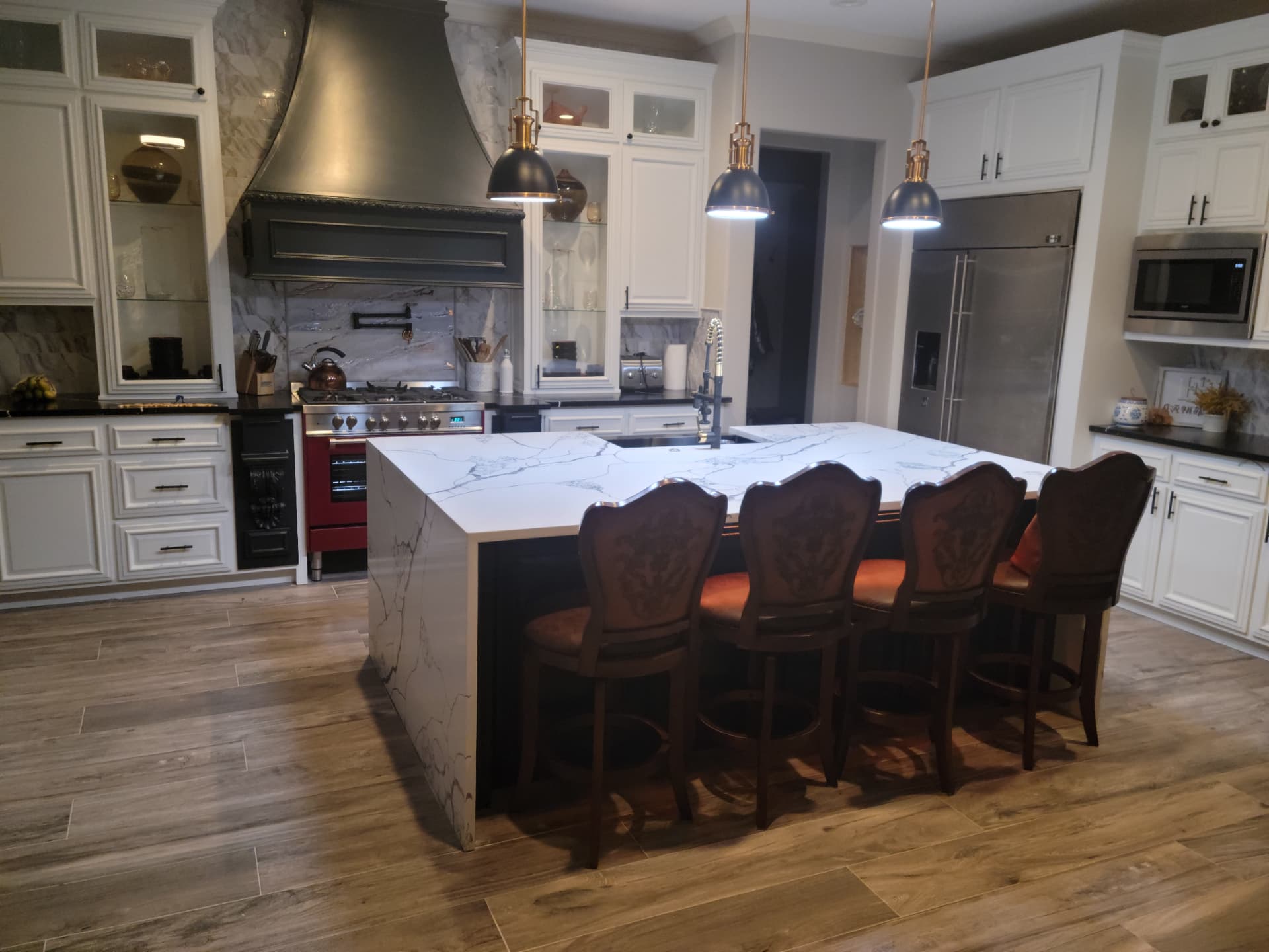 Kitchen renovation with custom island and range hood